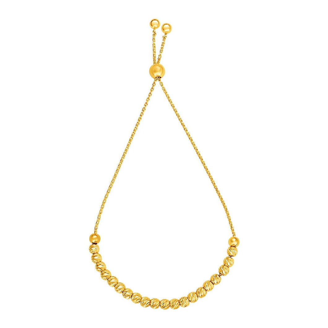 Adjustable Bracelet with Textured Beads in 14k Yellow Gold